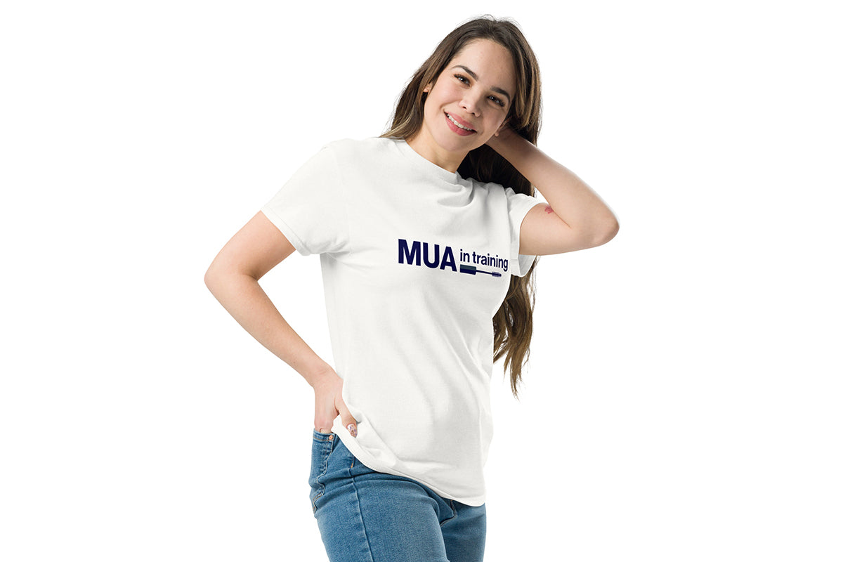 Woman wearing a white t-shirt with 'MUA in training' text on a white background
