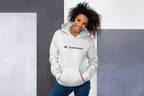 Woman wearing a gray hoodie with 'QC Event School' logo against a gray wall.