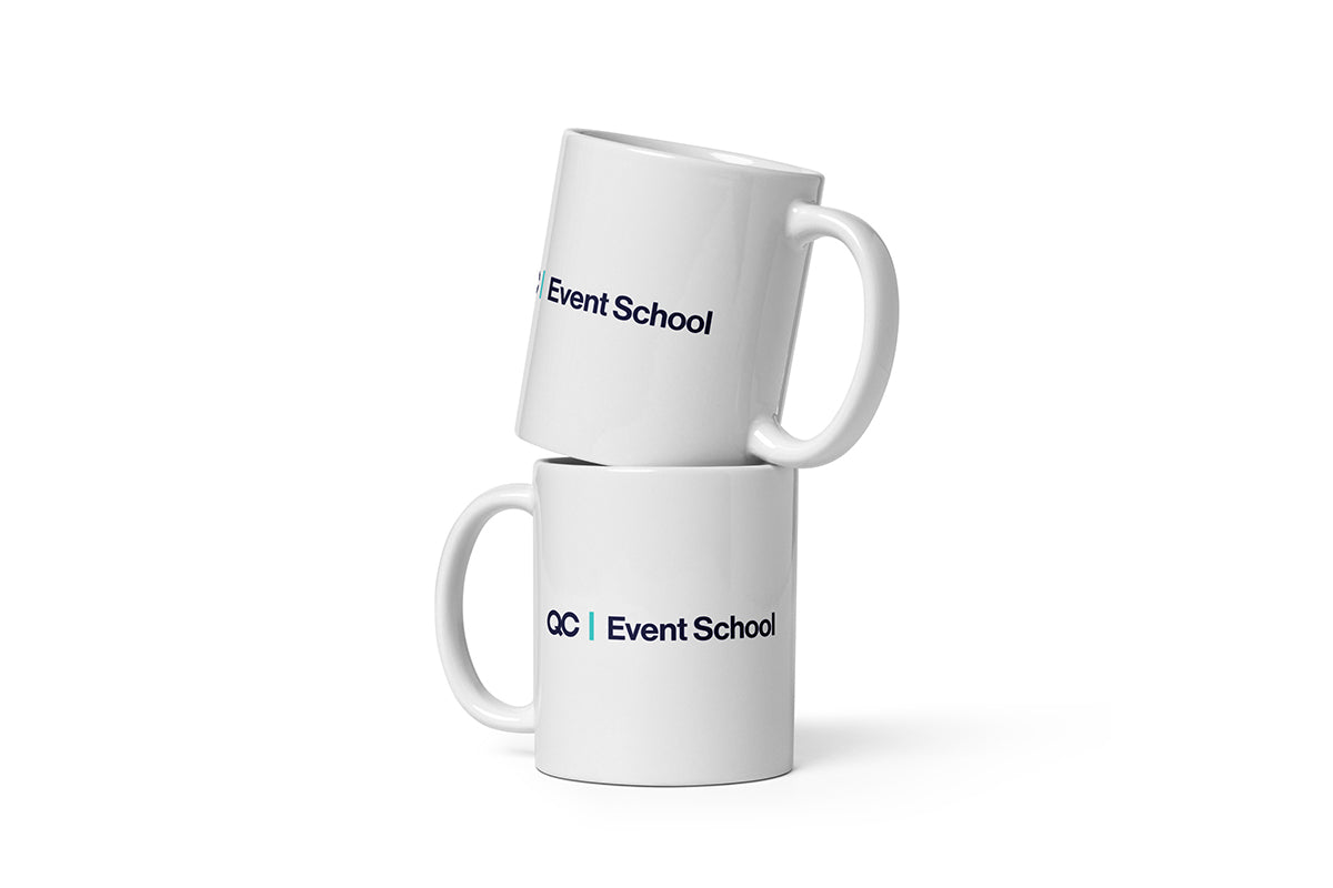 Two white mugs with 'QC Event School' text on a white background