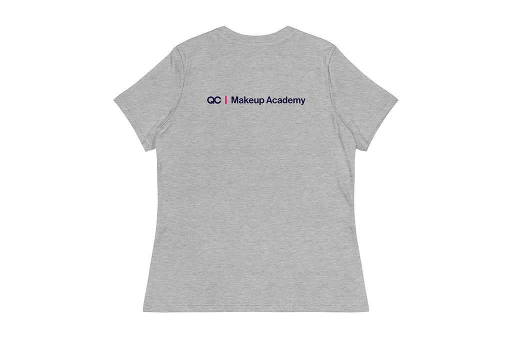 Back of gray t-shirt with 'QC Makeup Academy' text on the back against a white background