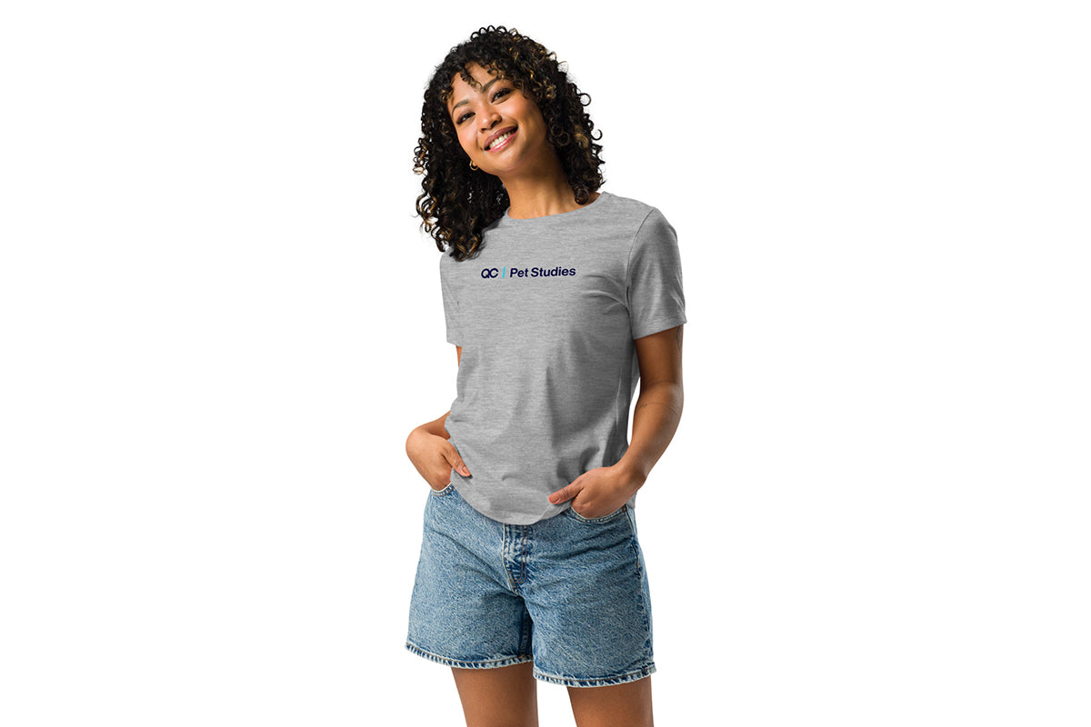 Person wearing a gray t-shirt with a QC Pet Studies logo on a white background