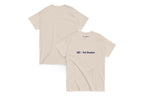Beige t-shirt with 'QC Pet Studies' logo on a white background