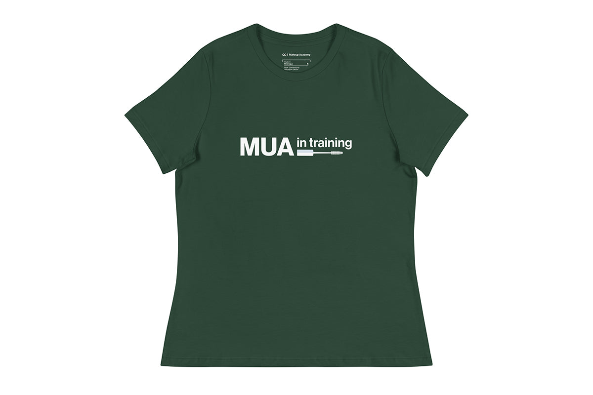 Green t-shirt with 'MUA in training' text on a white background