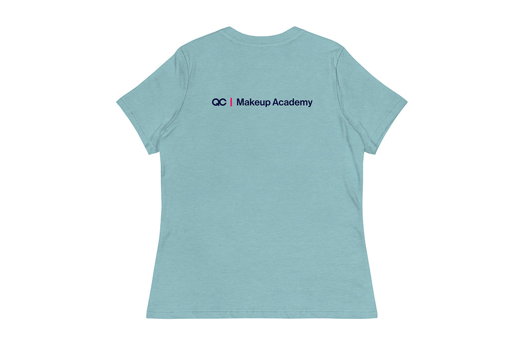 Back of light blue t-shirt with 'QC Makeup Academy' text on the back against a white background
