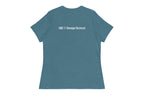 Blue t-shirt with 'QC Design School' text on the back against a white background