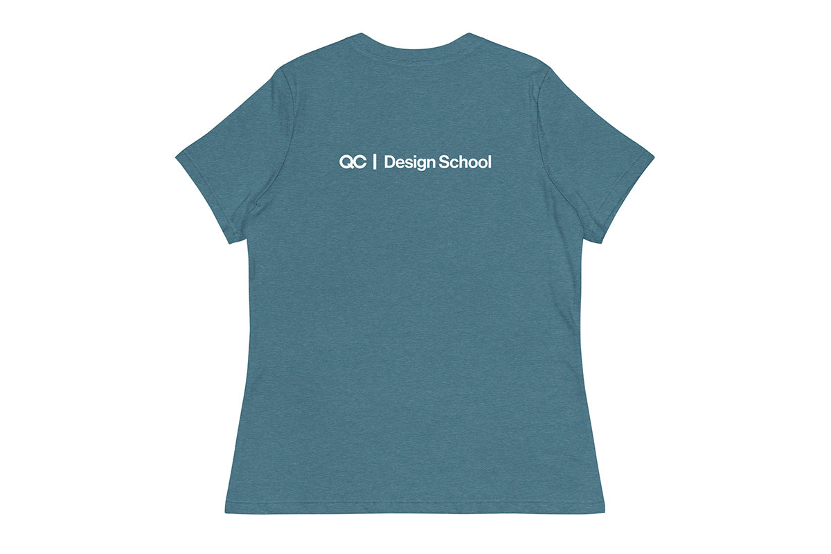 Blue t-shirt with 'QC Design School' text on the back against a white background