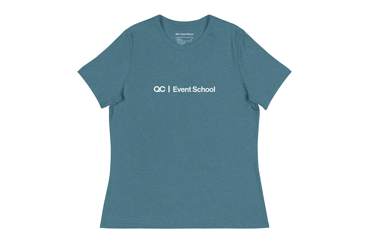 Blue t shirt that reads QC Event School