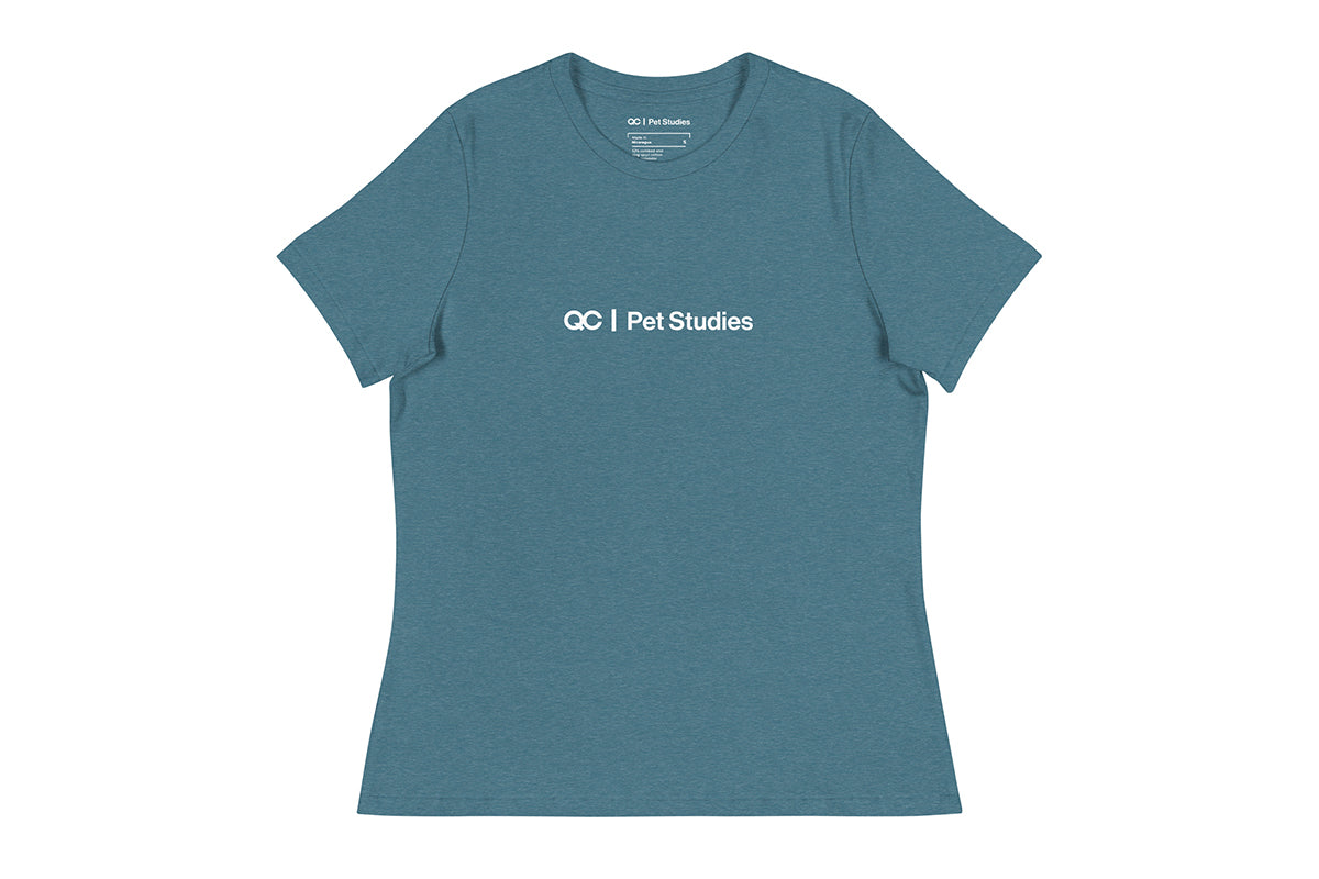 Blue t-shirt with 'QC Pet Studies' text on a white background