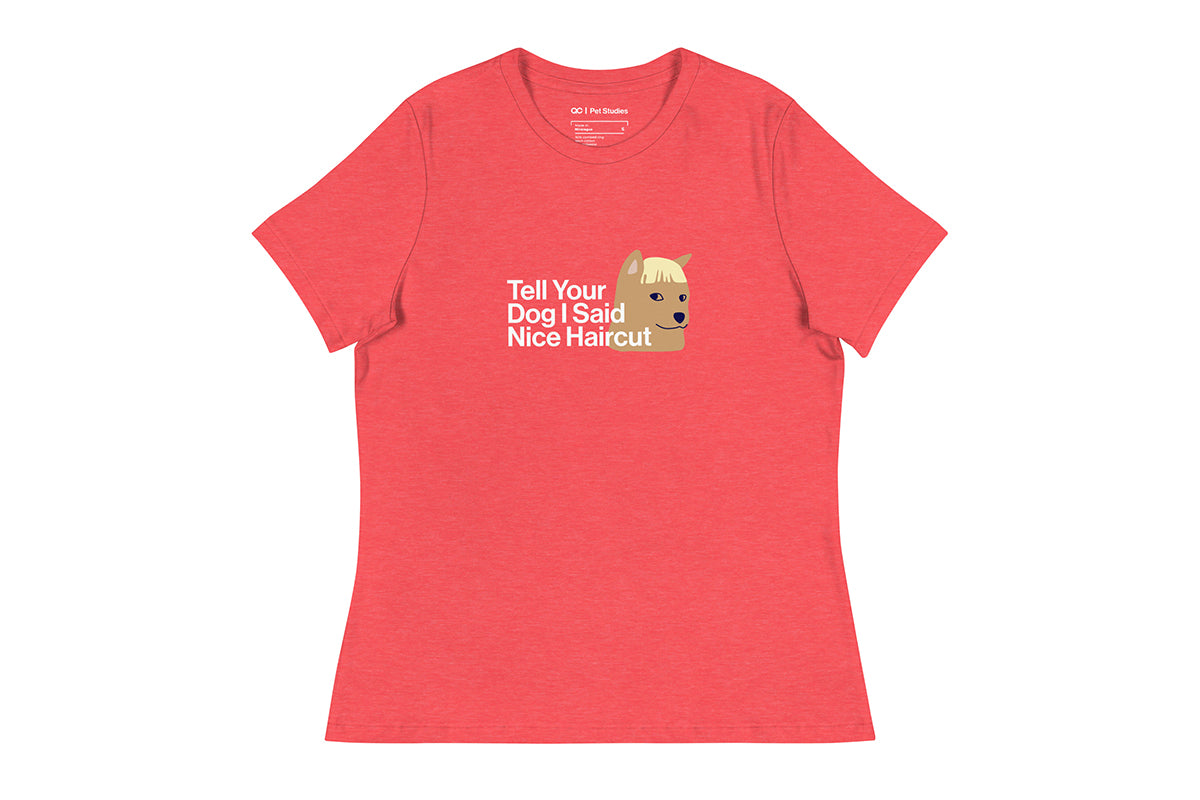 Light red t-shirt with a graphic of a dog and text that reads "Tell Your Dog I Said Nice Haircut" on a white background