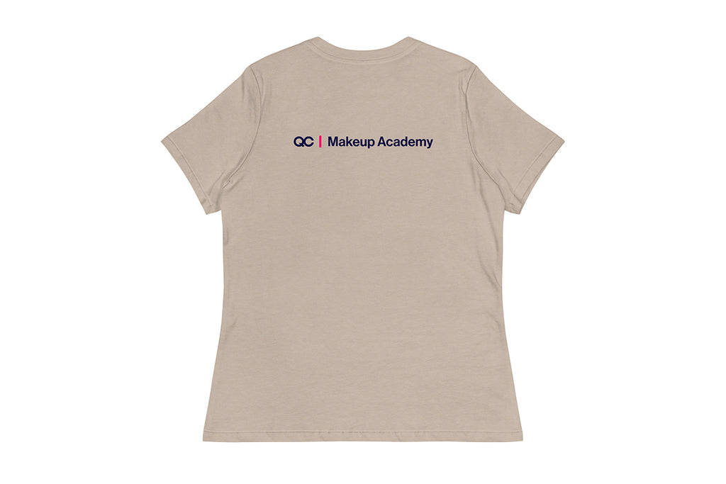 Back of beige t-shirt with 'QC Makeup Academy' logo on the back against a white background