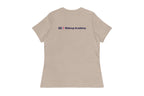 Back of beige t-shirt with 'QC Makeup Academy' logo on the back against a white background
