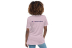 Person wearing a purple t-shirt with 'QC Makeup Academy' logo on the back against a white background