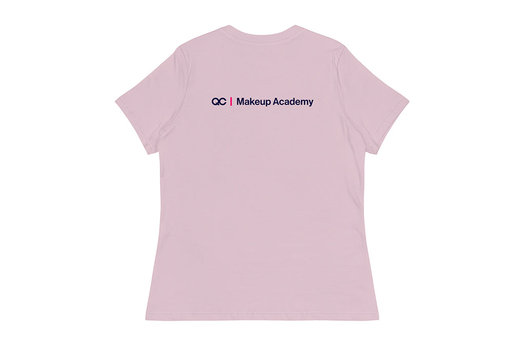 Back of purple t-shirt with 'QC Makeup Academy' text on a white background