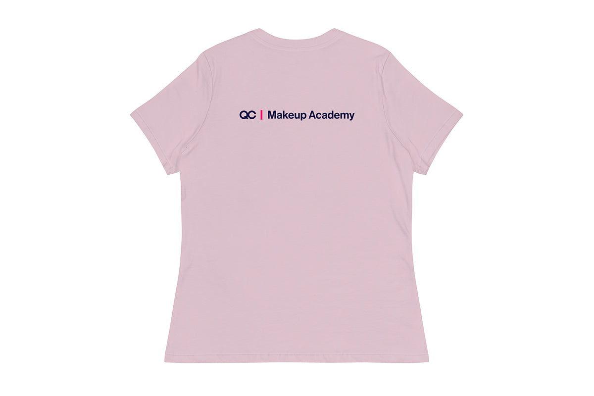 Back of purple t-shirt with 'QC Makeup Academy' text on a white background