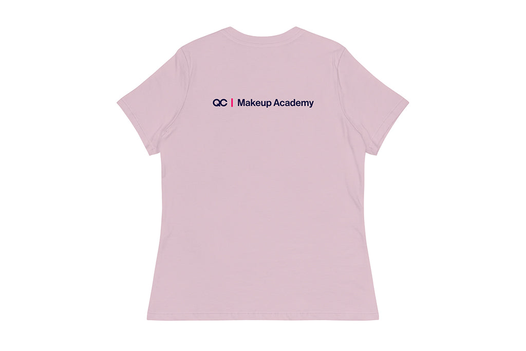 Back of purple t-shirt with 'QC Makeup Academy' text on a white background