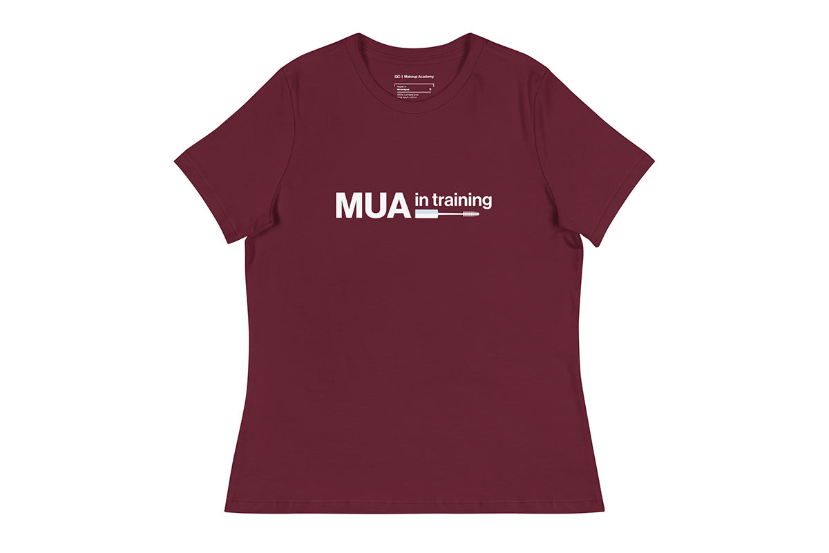 Maroon t-shirt with 'MUA in training' text on a white background