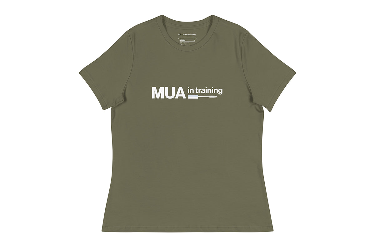 Green t-shirt with 'MUA in training' text on a white background