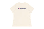 Back of beige t-shirt with 'QC Makeup Academy' text on a white background