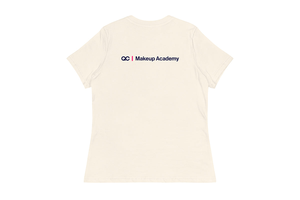 Back of beige t-shirt with 'QC Makeup Academy' text on a white background