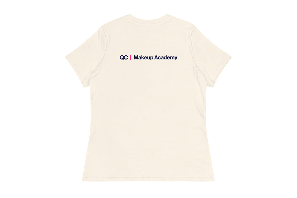 Back of Beige t-shirt with 'QC Makeup Academy' text on a white background