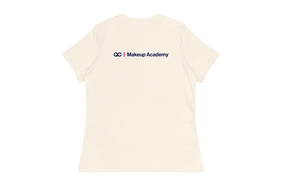 Back of Beige t-shirt with 'QC Makeup Academy' text on a white background