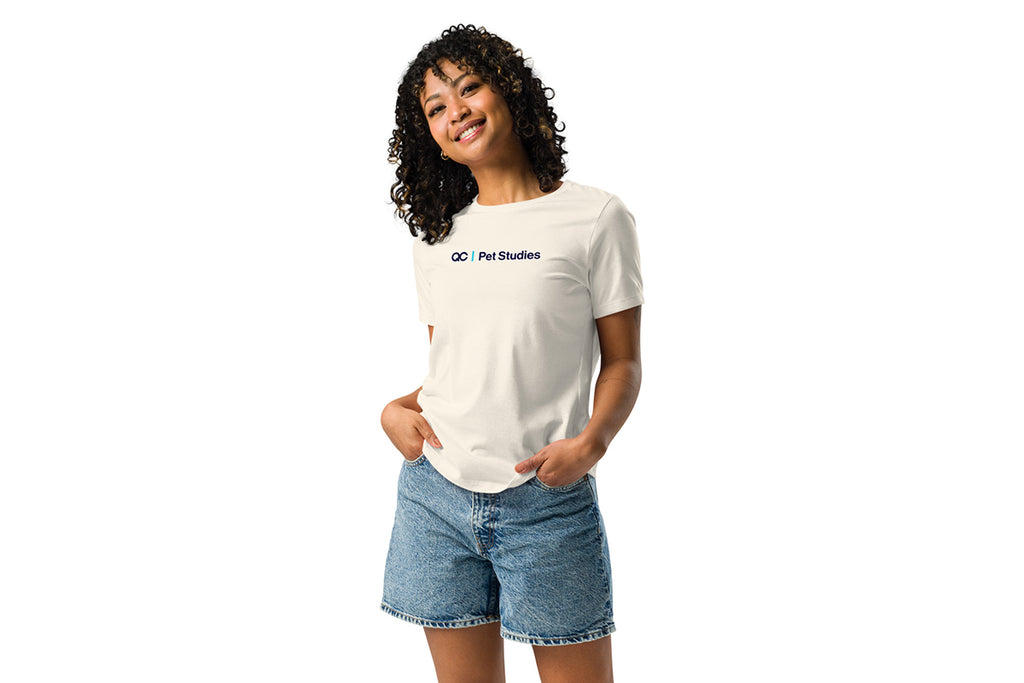 Person wearing a white t-shirt with a QC Pet Studies logo on a white background