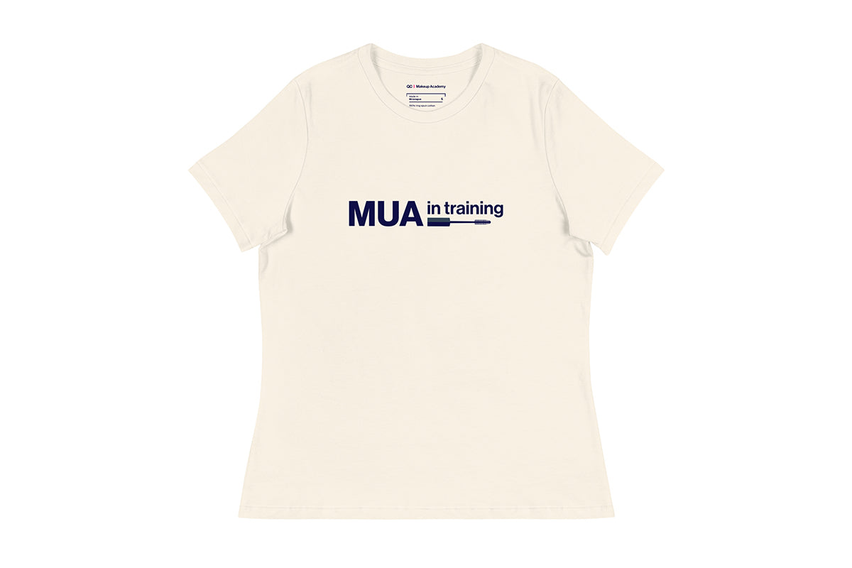 Beige t-shirt with 'MUA in training' text on a white background