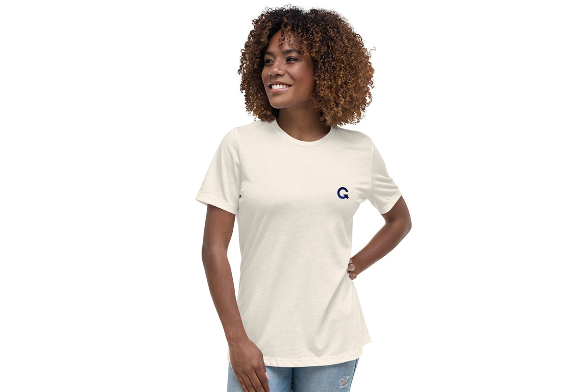 Woman wearing an off-white t-shirt with a Q logo on a white background