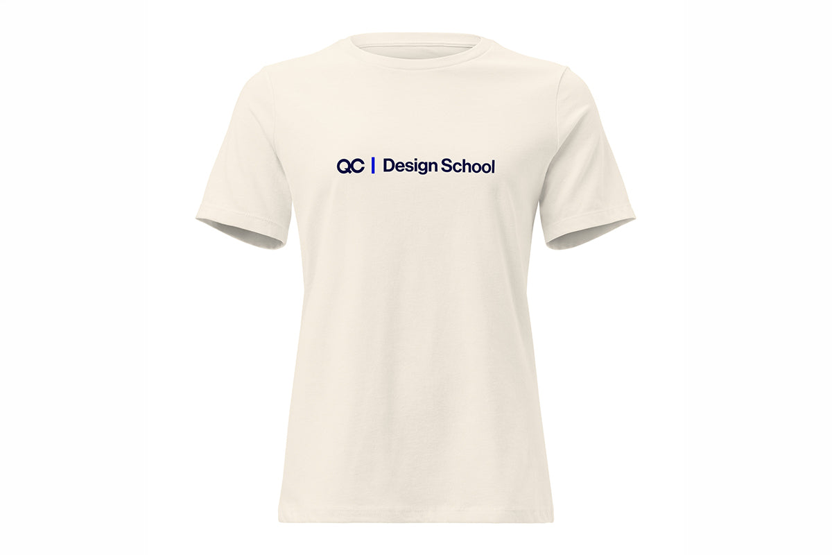 Beige t-shirt with QC Design School logo on a white background