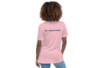 Person wearing a pink t-shirt with 'QC Makeup Academy' text on the back against a white background