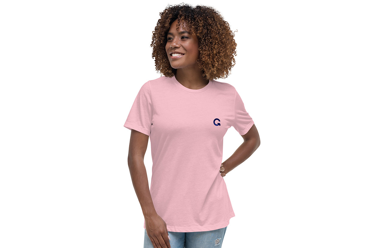 Woman wearing a pink t-shirt with a Q logo on a white background