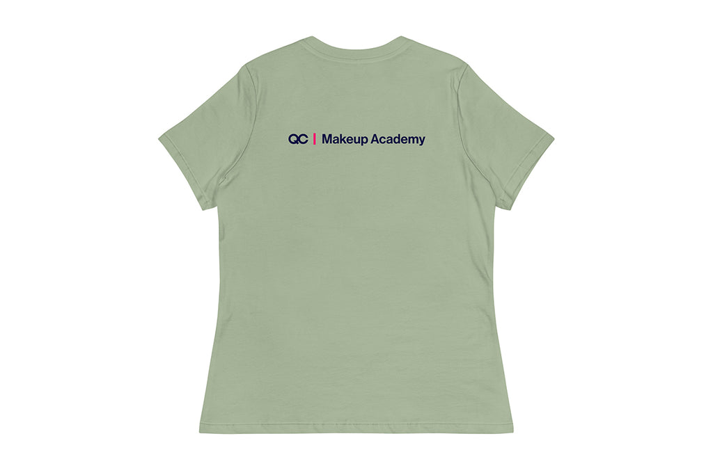 Back of light green t-shirt with 'QC Makeup Academy' text on the back against a white background