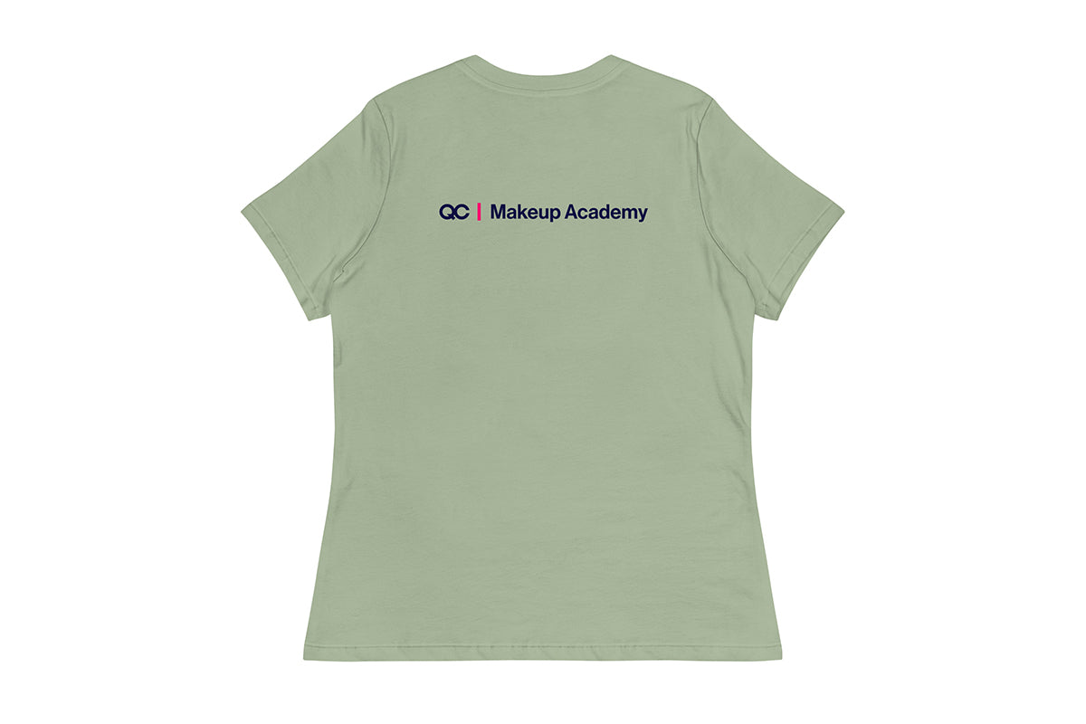Back of light green t-shirt with 'QC Makeup Academy' text on the back against a white background