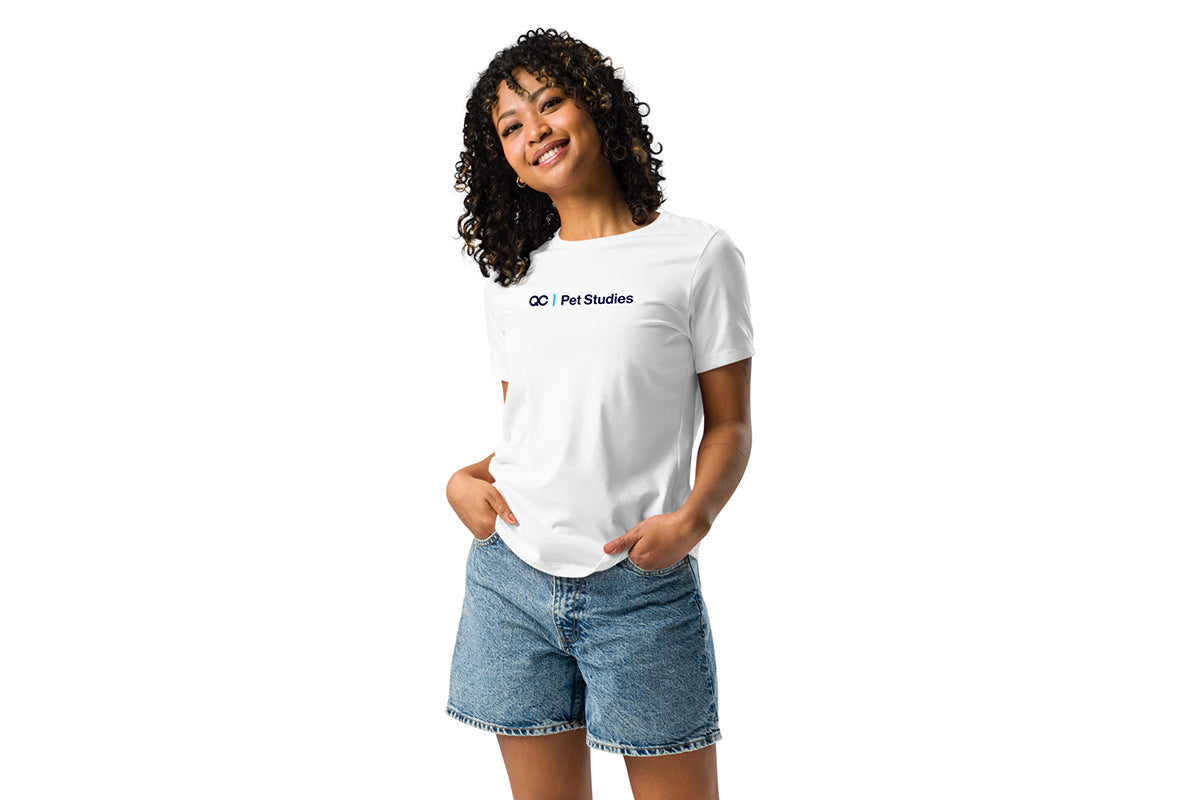 Person wearing a white t-shirt with a QC Pet Studies logo on a white background